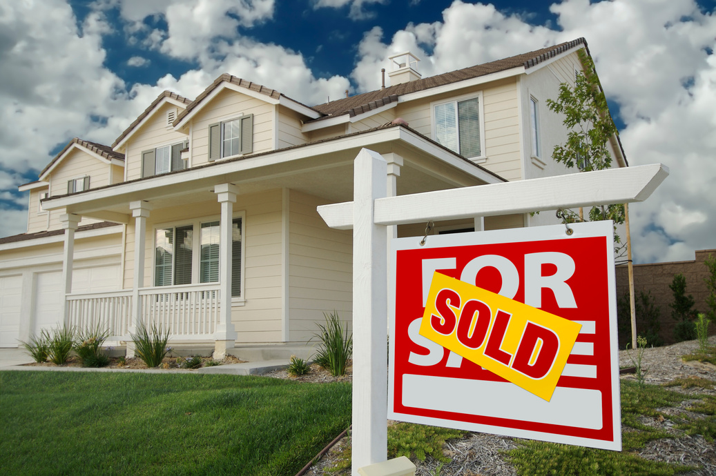 Sold Home for Sale Sign and House